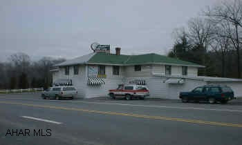 Qualified buyers only Famous area restaurant and lounge includes: business, real estate, equipment and liquor license, and good will.  Only liquor license in Catherine Township.  New sewer treatment facility on site.