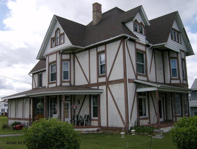 Carrolltown- 1895 Grand historic 5 BR home with original wood trim, doors, pocket doors & stained glass windows. New heat, radiators & new floor coverings. Large corner lot with in-ground pool. Potential rental income from the 2 BR apt above the 2 car garage.