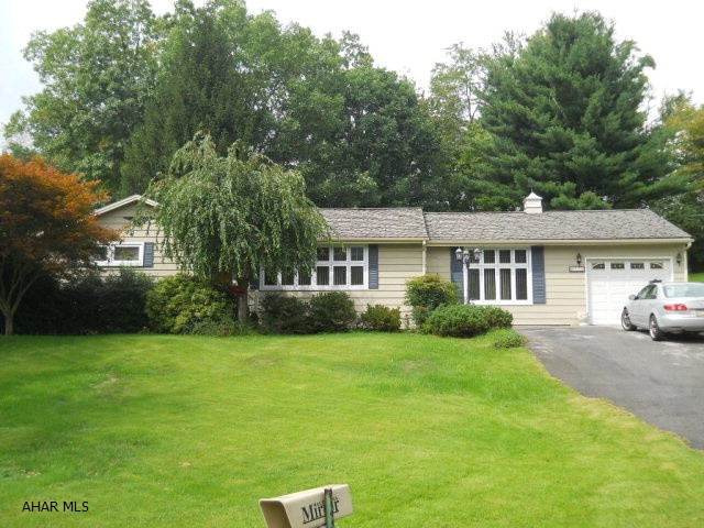Lovely ranch style home with 3 bedrooms, 1 bath, hardwood floors.  Large family room with gas fireplace.  Secluded yard.  Deck, sunroom.  One car attached garage.  Central Air.