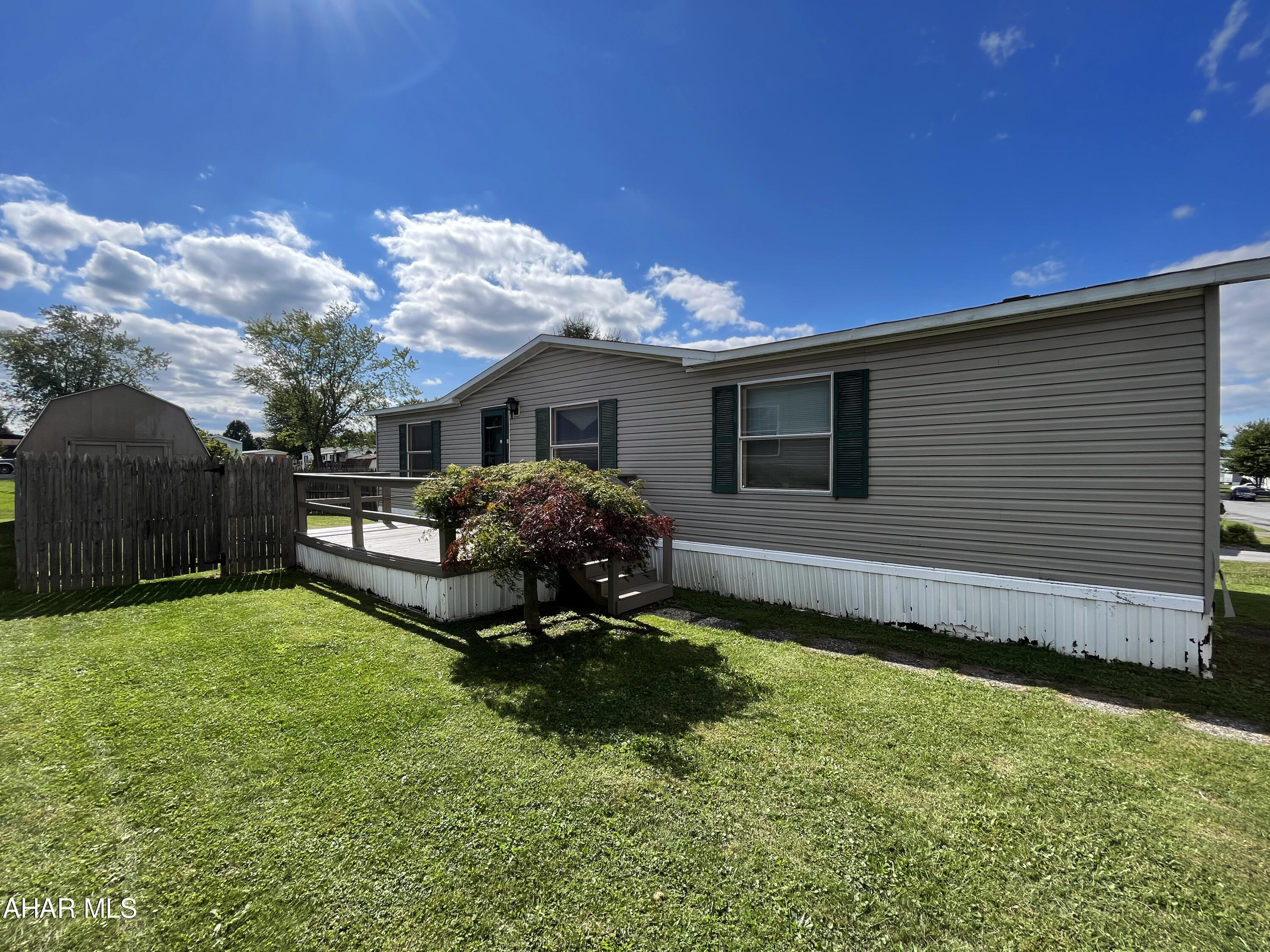 Nestled in the heart of Martinsburg, this magnificent Clayton double wide will have you feeling right at home. You will find yourself anxious to dabble with your culinary skills in the newly remodeled, spacious kitchen with ample cupboard space! You will enjoy time with those close to you in a fresh, open living room or in your front yard. With 3 bedrooms and 2 full baths, you can comfortably house a family or use the extra space for a craft room, office, or home gym. Find yourself within walking distance of Henry's Pond, outstanding restaurants, shops, and businesses and a quick drive to the Altoona-Blair County Airport. The home has undergone improvements such as new windows, electrical work, and updates to the furnace.

This home is situated on a lot that is managed by Mobile Realty. Buyers must apply at https://gomobilerealty.com/. Please view rules and regulations.