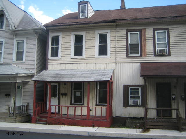 Two story Tyrone townhouse in need of TLC. Could be a real gem with your hard work and imagination. Features formal living room plus large eat-in kitchen, 2 bedrooms plus finished attic for possible 3rd bedroom. Vinyl siding and windows, nice covered back porch, fenced yard, off-street parking. Buyer pays both transfer taxes.