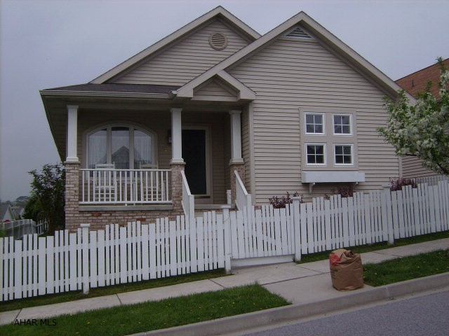 Cheerfully Decorated And Just The Right Size!!  Holliday Hills Cottage 1071 Sq. Ft. W/Attached Garage, Huge Deck, Hardwood Floors, Skylight, Enclosed Yard Good For Pets - New In 2004 - Seller May Leave Dining Table, Chairs & Buffet, Living Room Couch, Chair & End Tables & Small Bookcase In 2nd BR - Wonderful View From Deck - Nicely Landscaped - Basement Could Be Finished.