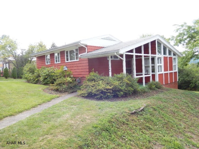 Unique home on large lot,with 2 car carport. This Multi level home has high vaulted ceiling and open floor plan, fireplace,family room and bonus room. Front porch also has a vaulted roof. Private 2 car carport doubles for a covered patio in the summer. Large back yard. This home is not your cookie cutter house. Must see inside. Newer Furnace. Seller is related to Listing Agent.