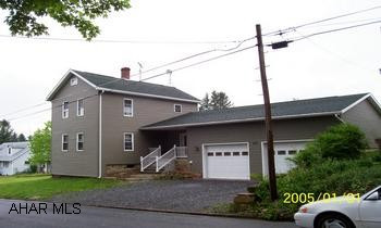 Could be 4 bedrooms, 14'x28' outbuilding. New addition with hardwood floors & ceramic tile in foyer, dining room, laundry and new spacious garage.
