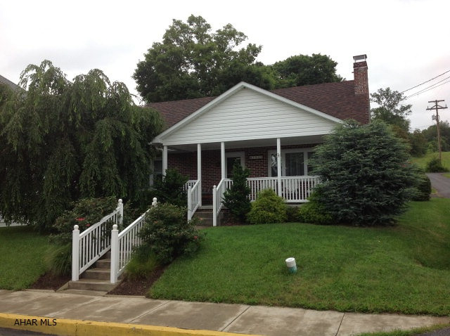 Move in Ready!!! 4 bedroom, 1.5 bath brick Cape Cod home. Very nice decorated country kitchen with hardwood cabinets. Features beautiful hardwood flooring, spacious rooms with storage, new windows, roof, vinyl porches.  Maintained and nicely landscaped with a garden and 2 car garage.  A must See!!!