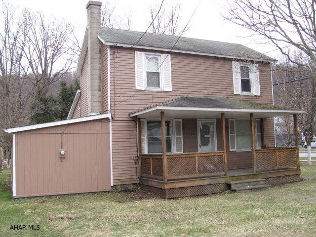 2 story aluminum sided home in Penns Manor school district. 2 car detached garage.