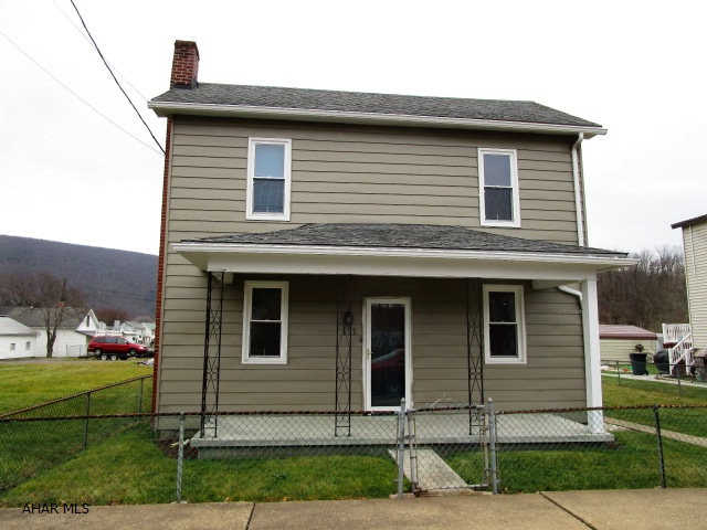 Well maintained and nicely updated two-story home! This property features a LR, eat-in kitchen w/breakfast bar, mud room, full bath, w/ C.T. floor and 2-beds. Architectural shingle roof, replacement windows, front covered porch & rear covered porch. Level fenced yard, paved patio w/fire pit, 1-car garage & 2-car carport. This is a nice property.