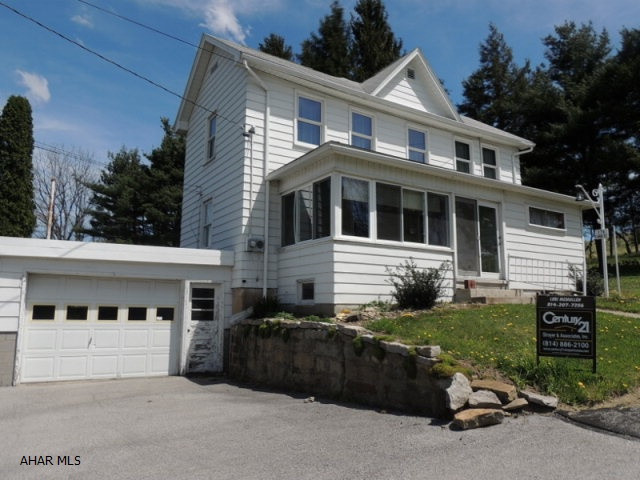 Large 4+ bedroom home on over 1.5 acres. hardwood floors under the carpet, 1 car attached garage, 2 car detached garage, large out building w/ many possibilities