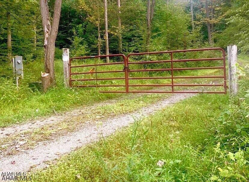 Clean and Green. This a beautiful piece of land located in Frankstown Township. 60 Acres ready for your homestead or hunting camp.
There are two building spots cleared with underground utilities.  A gated entrance with slate covered roadway runs through the property.  Underground Conduits are in place for future needs. Land was passed perc test but certificate has expired. Backs up to State Game lands