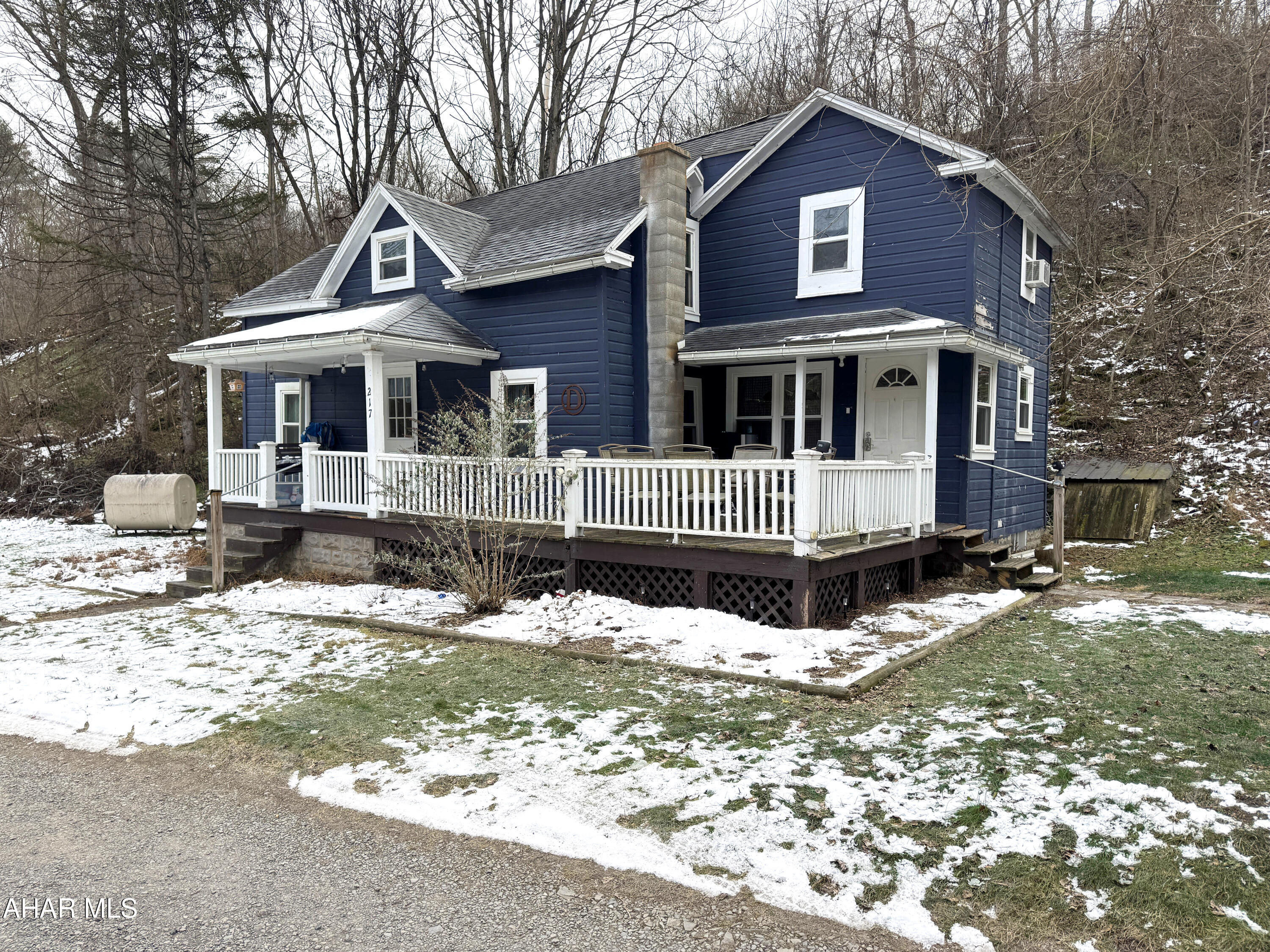 This cozy, country home is set back from busy streets and highways, tucked quietly within the countryside of trail town Williamsburg. It boasts a welcoming, country-style dining room, cute kitchen, vaulted living room ceiling, three upper level bedrooms, and a first level bedroom and bathroom. Use one of the smaller bedrooms as an office, play room, or craft room! There is plenty of space to run and play or to stay busy homesteading on this 3.15 acre property which is a stone's throw from Piney Creek and just down the road from the Juniata River Trail and Lower Trail of Rails-to-Trails.  Enjoy star gazing, beautiful mountain views, and wildlife sightings from the upper level deck or look forward to summer grilling, picnics, and relaxing to the peaceful sounds of the nearby stream from the large front deck. With a place like this to call home, you may not want to venture far, but no need to, as the town of Williamsburg is approximately three miles away with its small town amenities and nearby Route 22 provides easy access to the cites of Altoona and State College.