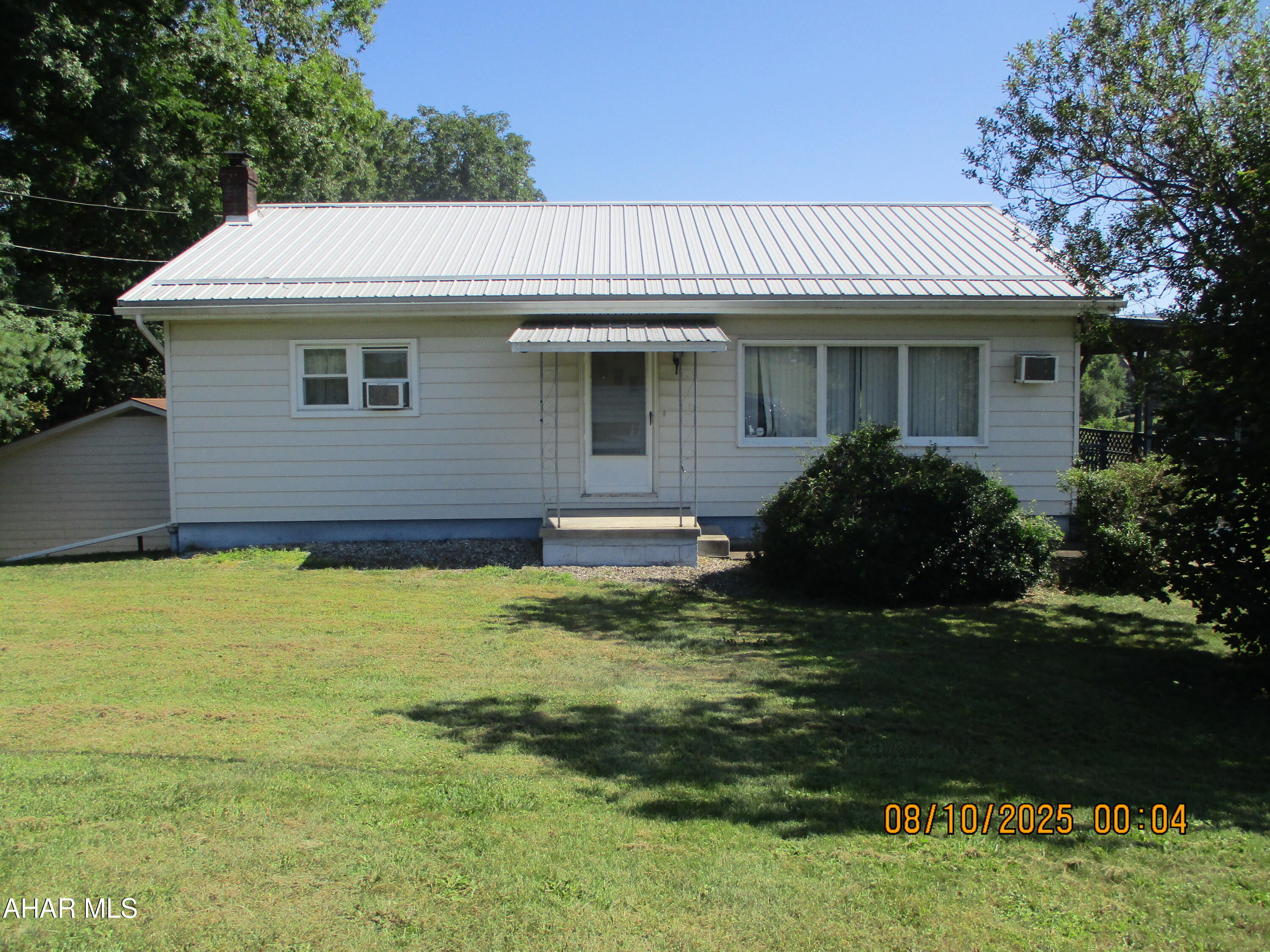 Looking for a two bedroom home with peaceful scenic views?  Take a look at this home located near Roaring spring!  Quiet development and many attractive features.  Partially finished basement with laundry and bath,  spacious living room, kitchen with seating area and dining area.   Detached two car garage, additional storage shed, firepit for warm summer evenings.  Country living yet close to all amenities!  Schedule your showing today.  Seller will have remaining personal items removed by end of August.