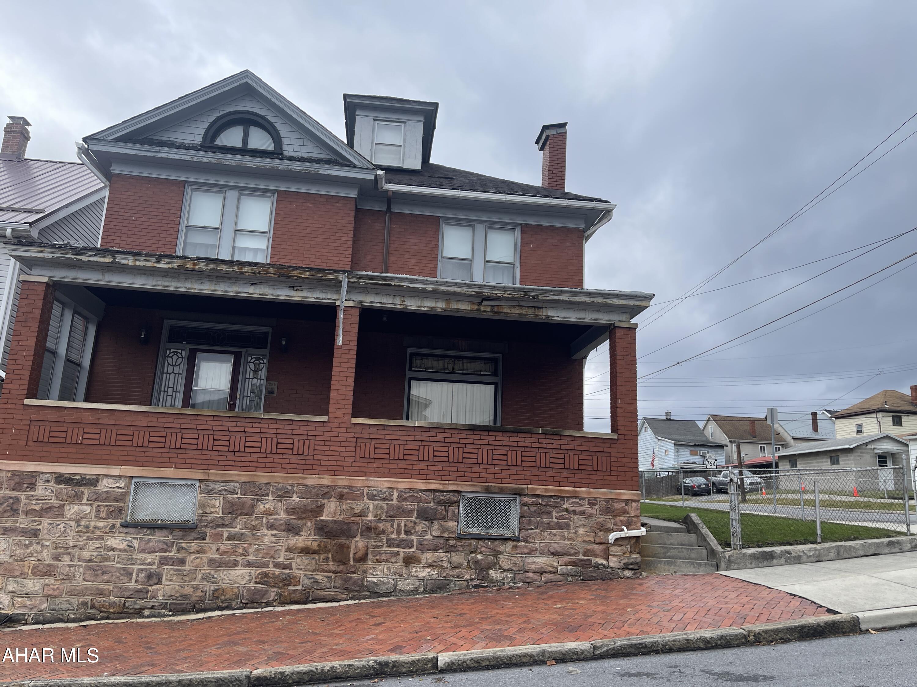 VERY spacious and lots of Charm still intact!  Beautiful hardwood flooring, Foyer, Cabinets in kitchen!  Well maintained!  Double corner lot and level.  Garage PLUS off street parking for all your guests.  Great place to start a family.  Close to shopping, banks, and hop onto I-99 in a jiffy!