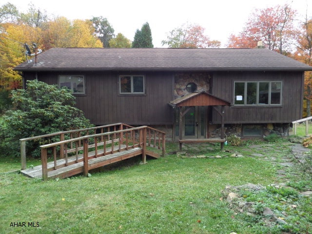 This 3 bedroom, 1 bath, bi-level home situated on 1 acre features hardwood floors and ceramic tile. Large eat-in kitchen w/ island.  Vaulted ceilings and sunroom gives this home an open floor plan. Plenty of room in the back yard for pets and kids to play. Some TLC and cosmetic repairs could make this your dream home. Buyer pays both transfer taxes.