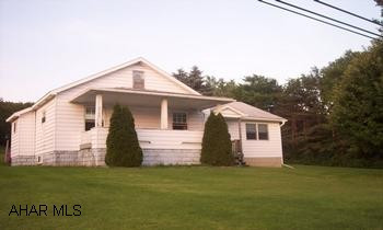 Lovely 1 1/2 story home situated on 5 acres!  Tax ID#  49-001-115 Map - 49-66-335 Ctrl. Lovely 1 1/2 story home situated on 5 acres!  Large sunken living room addition with corner propane fireplace.  Generous room sizes.  New windows throughout.  Walkup attic for storage.  Outdoor wood & coal burning furnace for low cost heating as well as oil furnace.  2 Sheds on property.  City water but also has 2 wells on the property.  Very near state game lands and still only 30 mins. from Altoona and Clearfield.  Currently has holding tank, but city sewage is coming thru in spring 2010.  No Mineral Rights being conveyed.