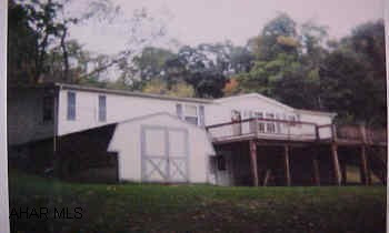 Big, beautiful, immaculate doublewide on a full foundation on 7 very secluded acres n Logan Township. Seller must find suitable housing. Big, beautiful, immaculate doublewide on a full foundation on 7 very secluded ares in Logan Township. Seller must find suitable housing.DIRECTIONS: Take Mill Run Road to Old Mill Road, to 15th Avenue to Weaver Road
