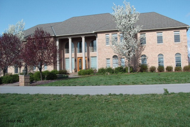 Scenic Pine is located near Hollidaysburg Area High School. Total 8 car garage, inground heated pool with fiber optic lighting. 5 or 6 bedrooms, 6 full baths plus 2 half baths. Master suite with columns and fireplace with sitting area, wet bar, 13x14 walk in closet and 13x16 master bath. Third floor has hardwood floor, a ballet bar and skylight. 4 gas forced air furnaces, plus 12 zones. Separate 3 car garage with finished apartment above.
