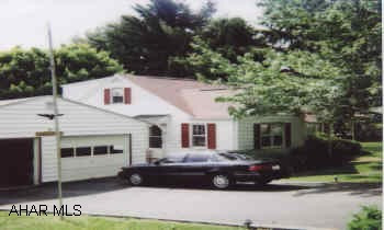 one & one half story vinyl , 4 bed, 2 bath, Lr, Dr, Kit,  hardwood floors 1st floor, fireplace Living room, 2 alternate heating units. family room basement