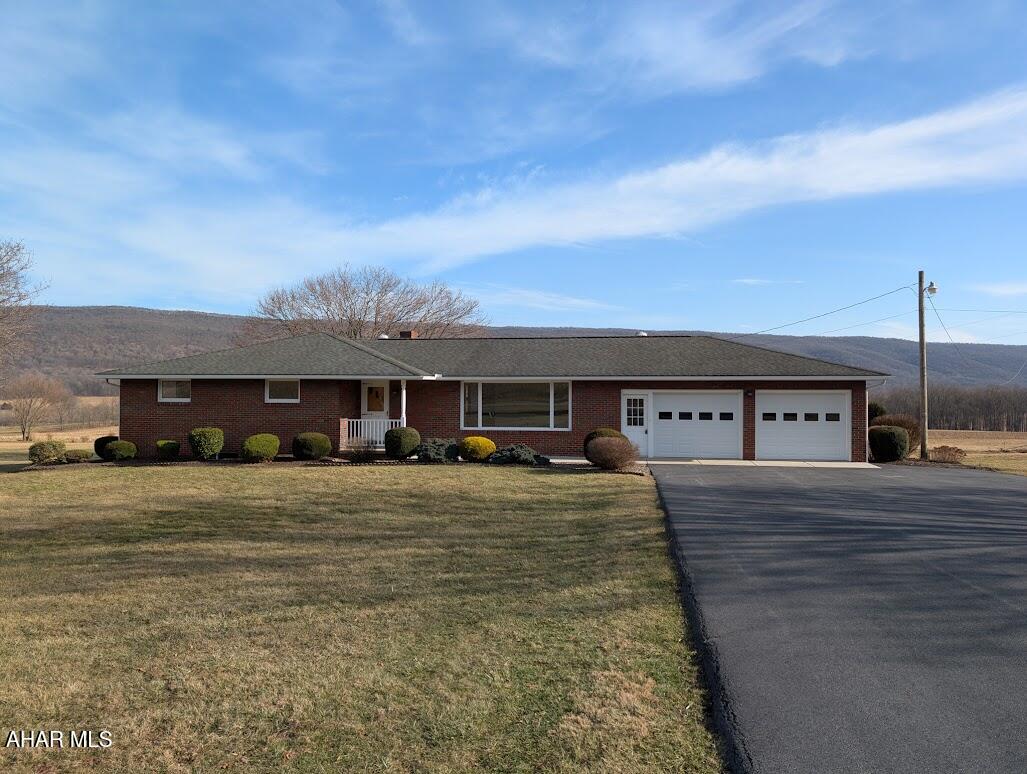 Charming Brick Ranch on 2 Acres with Stunning Mountain Views & Cozy Den!

Nestled on 2 beautiful acres, this solid 3-bedroom, 2-bath brick ranch offers breathtaking mountain views and endless potential! The spacious living room features a large picture window, flooding the space with natural light and showcasing spectacular panoramic views of the mountains.

Inside, you will find some hardwood floors, new luxury vinyl flooring, and fresh paint throughout. The cozy den is the perfect retreat, complete with a fireplace and built-in gun cabinet, a warm and inviting space to unwind.

Step outside to enjoy the back patio, a great spot for morning coffee, outdoor dining, or simply relaxing while taking in the serene surroundings. The well-maintained macadam driveway leads to an attached 2-car garage with a convenient mudroom, adding functionality to the home. The level lot provides plenty of space for outdoor activities, gardening, or future improvements.

While this home has classic charm, it also offers endless possibilities to make it your own. Don't miss this opportunity to own a well-built home with stunning views and room to grow.