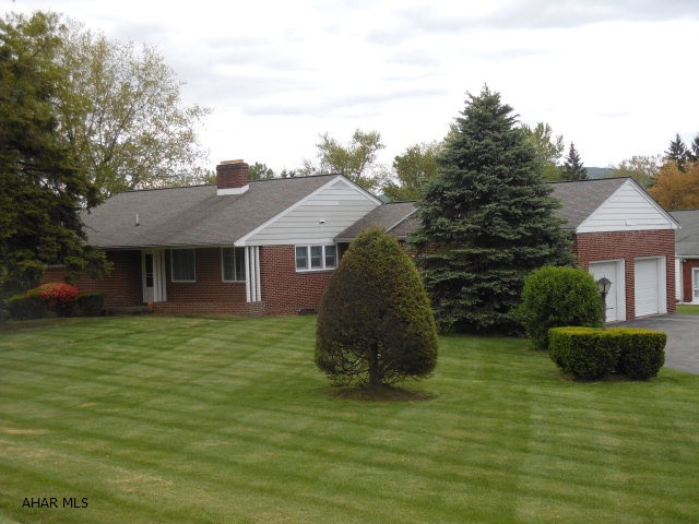Solid Brick Ranch home on beautiful large corner lot with 2 car garage. Living room with stone fireplace,dining area, eat-in kitchen, den, 3 bedrooms and 2 baths. Hardwood floors under carpeting. Full basement w/ lots of storage. House does need updating. MOTIVATED SELLER!