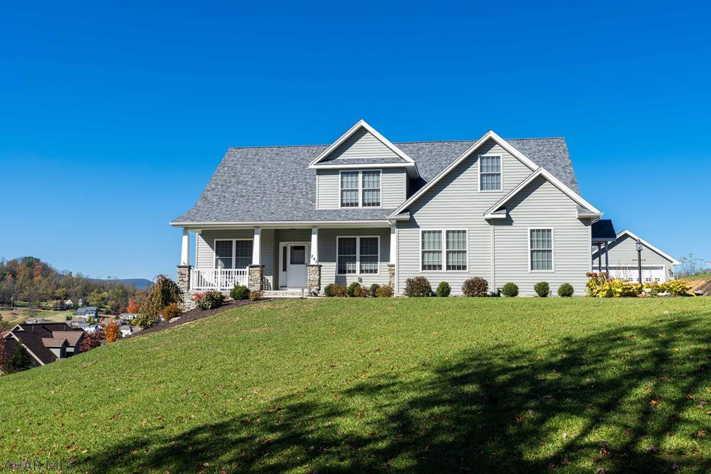 Beautiful newer home in H-burg School District. 4 BR (1st Floor Owners' Suite), 3.5 Baths. Kitchen Boasts Granite C-tops, Wolf Range with Infra-Red Warmers, Over-Sized Hood and a Griddle! 2nd Floor has a Loft Area, 3 BR's, Full Bath and Storage.  Professionally Finished, Daylight Lower Level with Kitchen, 3/4 Bath and Family Room...Radiant Flooring Makes it a Perfect Winter Entertaining Space. Hardscaping Done by Tussey Mountain, Complete with a Fire Pit. This Home Offers Tons of Storage, Space for Everyone and Great Views, Plus  Garage Parking for 5 Cars!  Convenient Location, Yet Tucked Away.