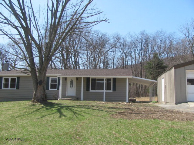 Charming 3BR, 1.75 BA rancher situated in the country side. This completely updated and remodeled home is open and spacious with warm and inviting earth tones. Laminate flooring through out, Large Living Room off the Dining Area and Kitchen is great for entertaining. Situated on 1.26 acres with private back yard that boarders wooded acres is abundant with wild life.