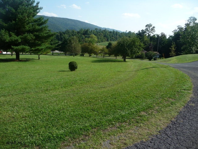 Beautiful 1.5 + acre building lot with great mountain views, in Sunny Slope Development. Conveniently located in close proximity to Wal-Mart and Bedford Co. Hospital. This lot is perc tested and ready for you to build your dream home on. The lot is already landscaped and has an established lawn.