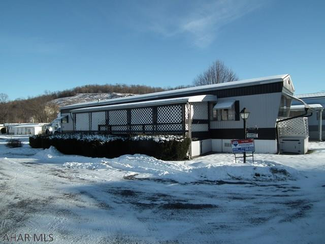 Priced to sell!  2 Bedroom, 1 Bath, nice size Living Room, Covered Deck, 55+ Community.  Lot Rent includes min. water, sewer, trash & snow removal.on main Streets.