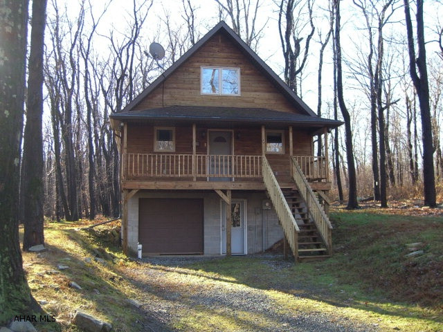 Beautiful mountain retreat or year round home in Blue Knob State Park. Privately situated with easy year round access. Two bedrooms/loft and two full baths upstairs. Kitchen bedroom and full bath downstairs. Close to the ski lifts and golf course. Low HOA fees of $150/yr include road maintenance, biking/hiking trails, trash removal, use of restaurants, outdoor pool, tennis Courts. Snow plowing of driveway and use of indoor pool, hot tub and sauna available.