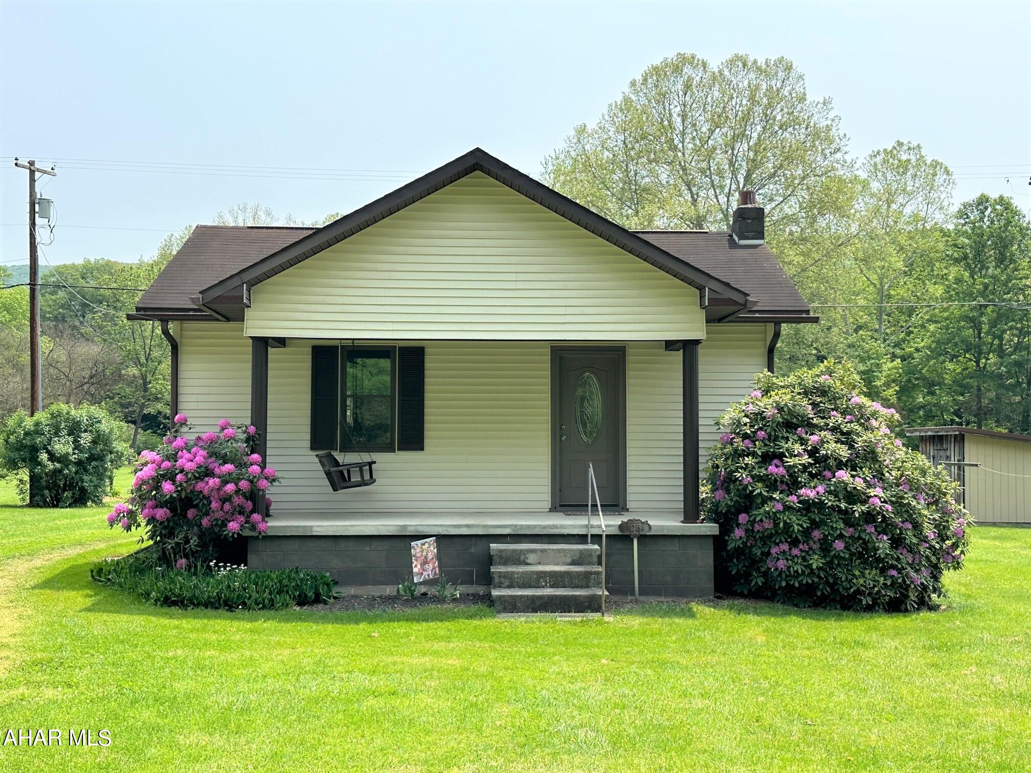 Very well maintained one-story home featuring a large flat yard and a relaxing meandering creek. Situated just north of the Maryland/PA border in southern Bedford County, it offers easy access to I-68, Cumberland, Bedford, Rocky Gap Resort and State Park and the Omni Bedford Springs. This would make a beautiful, cozy, year-round home or perfect get-a-way property. Updated features, full basement with interior and exterior access, electric baseboard, and 100-amp circuit breakers. Large entry foyer or sitting room, dining/LR combo, kitchen, two bedrooms and a full bath. Covered front porch with concrete decking and rear covered porch.