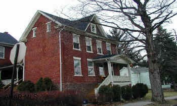 Possible delayed possession.  Wonderful brick home in Hollidaysburg.  Private Porch, side yard - 3 bdrms, walk up attic, Lg kitchen, Lg basement for storage.  Longer elementary. 2nf Floor Laundry,5-yr Old Roof, Water Tank 2-years.  Possible delayed possession.  Wonderful brick home in Hollidaysburg.  Private Porch (porch wall is the only common wall to attach bldg.  None of the house walls are common walls.)  Private side yard - 3 Bdrms - Walk up attic - Lg kitchen - Lg basement for storage.  Longer elementary - 4 blocks from Jr. High.  Move in and feel at home.  See pictures.  Call Dee 934-3054.