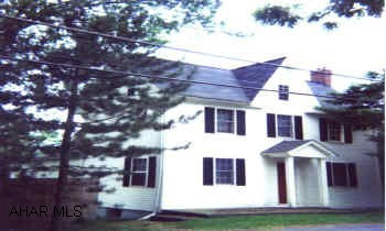 GREAT SETTING! APPROX. 1 ACRE, 2 CAR DETACHED GARAGE, COVERED REAR PORCH.