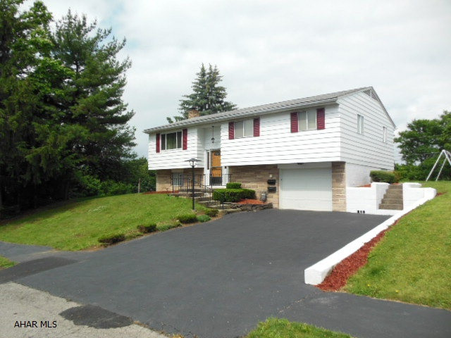 Reduced! *Pending-Taking Back-ups.  Stunning 3 BR, 1.75 BA, Beautiful Bi-level in East End!!  New HE furnace w/Central Air, nice Berber carpeting, new refrigerator, stove & hood. Marble windowsills. 1 car integral garage with opener & 2 car detached garage with New sheeting & Architecturally Designed shingles (transferable warranty).  Large foliage-buffered corner lot. Large family room with wood-burning fireplace and new beautiful carpeting / baseboard. Lower level 3/4 bath, utility has a new hot water tank, walkout door w/ stormdoor. Nice covered rear porch, gas grill and security lights.  Detached garage on a dead-end alley has a cement floor, A/C window unit, and extra storage accessible from inside and outside the garage.(new roof). Some newer windows and new plumbing! This home glow