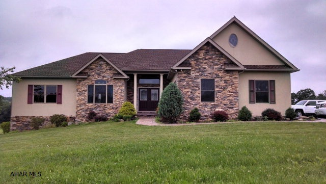 Absolutely beautiful home built by Bill Waltman. Stunning views on almost 42 acres in Chestnut Ridge School District. Open floor plan with hardwood floors, vaulted ceilings, skylights, granite countertops and custom cabinets. Master bathroom has his/her vanities, garden tub and double tray ceiling. Bonus room over garage with skylights. Must see to appreciate.