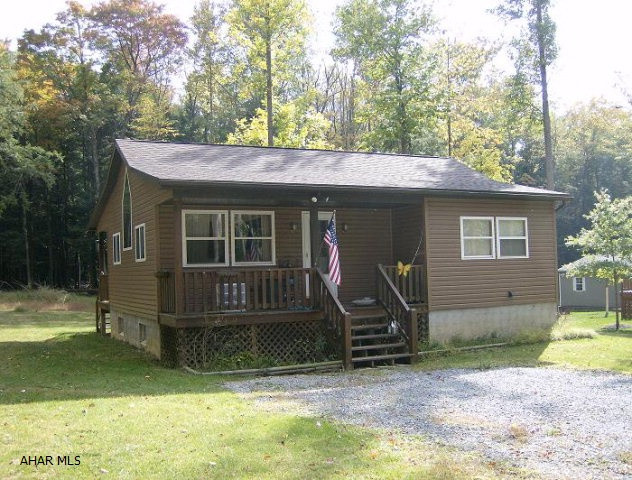 Possible short sale. 1 story 2 BR, 1 3/4 bath home on 0.59 acre lot in Glendale Yearound.