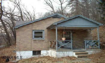 Brick Bungalo in need of remodeling. Big lot. Call office for showing instructions.