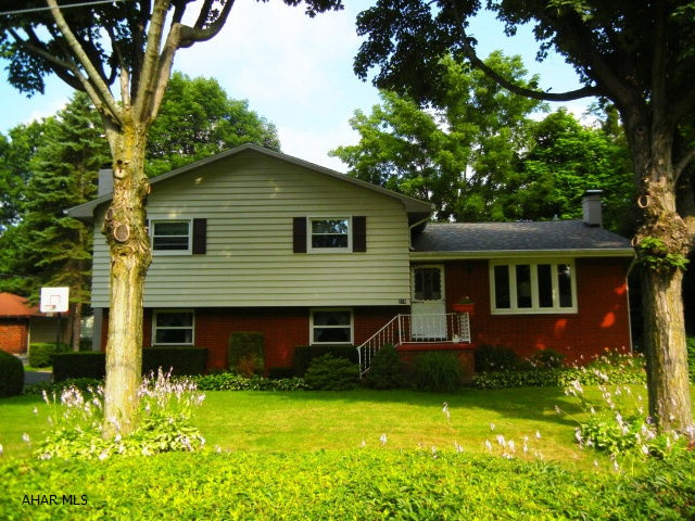SELLER WORKING WITH ENGINEER TO HAVE HOME REMOVED FROM FLOOD ZONE - SHOULD HAVE ANSWER WITHIN 2-3 WEEKS.  LOOKS PROMISING.....Pride of ownership shows through this meticulously cared for home!  This home sits on a very large lot (.39 acre) The kitchen is newer and offers a breakfast bar.  Separate dining room to host Holiday Dinners.  Entertain in the family room in the lower level and stay cozy with the pellet stove or TINKER in the workshop area.  Enjoy the peace and quiet on the large covered cement patio (ALSO DOUBLES AS CARPORT!!) Property sits on a large corner lot.  New roof, seemless gutters, windows all within last 4 years