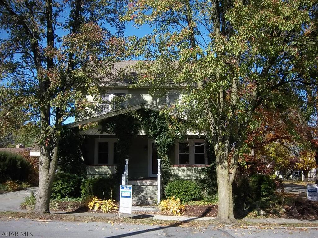 Corner Lot, 4+ bedrooms, 1 bath, hardwood floors, French doors to kitchen and dining room.  Updated kitchen and bath, built-in linen closet outside of bath.  Newer furnace, roof, windows, bath (stunning shower), private brick patio and carport.  There are two thermostats in the house.  One in the dining room controls all the radiators.  The one going toward the kitchen controls the radiant H/W heat in the kitchen floor.  All sewer work updated and inspected as required by Hollidaysburg Borough.   Buyer to verify taxes and square footage.