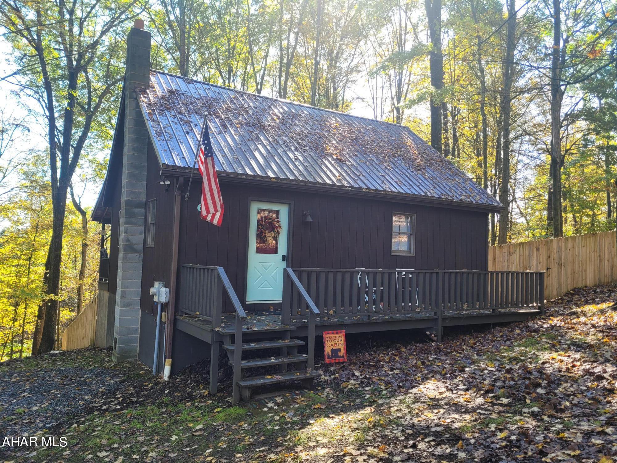 Adorable cabin is ready to become your private getaway.  The large great room sports a cathedral ceiling and an electric fireplace to add to the cabin feel.  Two sleep areas and a full bath take care of the necessities so you can focus on what you come to the woods for - relaxing and watching the wildlife around you.  Sit on the back porch and keep your eyes on nature and your children and / or pets in the divided fenced in area.  
Enjoy the amenities of Glendale Yearound:  club house, swimming pool, tennis/basketball/volleyball courts, playgrounds, dog park, etc. or heat over to Prince Gallitzin State Park / Glendale Lake for boating, hiking, or taking a picnic lunch.  State Game lands 108 are right down the road and Rock Run ATV park is six miles away.
