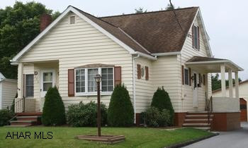 Charming Cape Cod with 3 Bedrooms and 2 full baths. Charming Cape Cod, 3BR/2BA, kitchen w/breakfast nook, dining room w/ built-in cupboard, living room, ceiling fans and thermo pane windows.  Finished basement with bar. Large detached 2-car garage, storage outbuilding, level back yard with picnic pavilion. Wood siding with shutters.