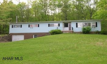 Near State Game Lands.  Well maintained DW with full foundation on 3/4 + acre lot.  Newer oak Kit.  2 BR 2.5 BA, LR -DR combo, Family Rm.  Closed in porch, patio, Large 4 bay garage w/heat & elect, covered RV parking. Part wooded. Near State Game Lands.  Well maintained DW with full foundation on 3/4 +acre lot.  Oak Kitchen 2 BR, 2.5 BA,LR-DR combo, Fam. Rm.  Closed in porch, patio, Large 4 bay garage w/heat & elect. Covered RV parking.  Part wooded.