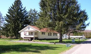 Vinyl sided 1 1/2 story on large lot and private setting. 2 bedrooms, many extras and much more!