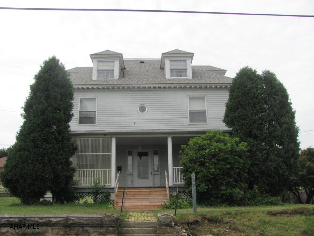 Large home in Patton Borough with newer windows, roof and siding. Property could be a single family residence or a 3 unit rental with separate electric and laundry hook ups.