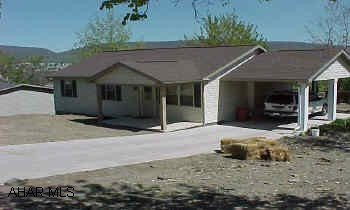 New 3BR ranch next to Garfield Park. Large corner lot, living room with fireplace, and carport.