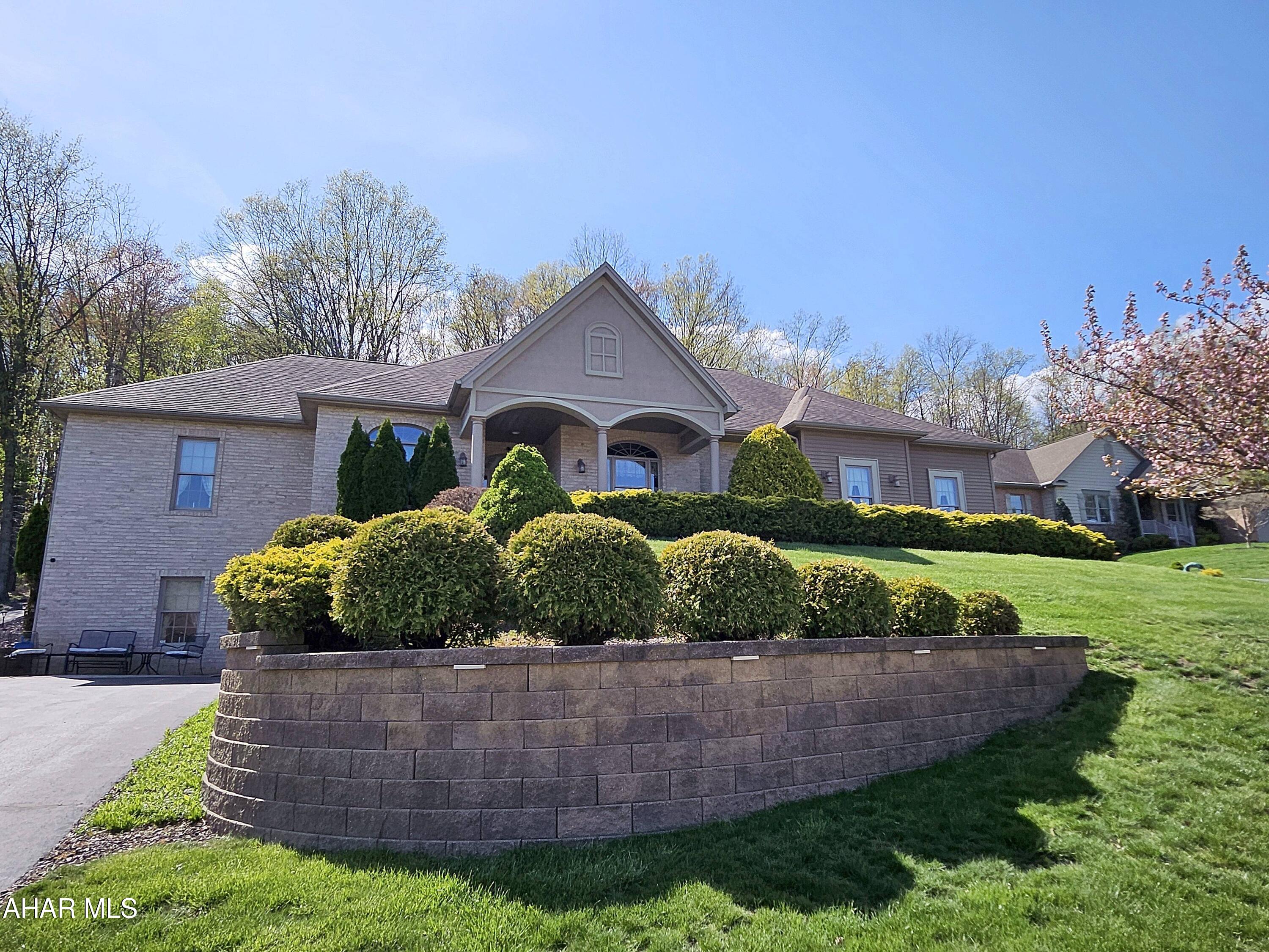 As you step into the 5,572-square-foot home at 169 Hollow Run Trail, you're greeted by custom glass front doors with elegant sidelights and a striking arch light above. The attention to detail is evident from the very beginning, with cherry crown molding and arch-topped doorways enhancing the entryway. This seamless introduction leads into a spacious and open floor plan, setting the tone for the rest of the home. This exquisite home, crafted by renowned builder Greg Dempsie, is a true testament to fine craftsmanship and thoughtful design. Every corner of the house reflects a high level of attention to detail, ensuring a sense of elegance and comfort throughout.
In the formal dining room, family and friends can enjoy meals in an atmosphere of spaciousness and charm. The room is bathed in warmth, with crown molding accentuating the 9-foot ceilings, and rich cherry hardwood floors that flow seamlessly throughout the space. A striking large arched window not only provides ample natural light but also mirrors the arched doorways found elsewhere in the home, each adorned with decorative ornamental rosettes that add a touch of classic beauty. This harmonious blend of design elements creates an inviting and refined space perfect for both everyday living and special occasions. This kitchen is a true masterpiece, designed to inspire and elevate every cooking experience. From the moment you step in, you're greeted by sleek, custom cabinetry that stretches to the ceiling, offering both style and ample storage. The countertops are a stunning granite, catching the light and creating a luxurious feel.
Upgraded appliances—think double ovens, a six-burner gas range, and a built-in fridge—make this kitchen perfect for those who love to cook and entertain. The large, center island is a showstopper, with plenty of prep space and a built-in sink for convenience, making meal prep a breeze.
Ample natural light pours in through large windows, illuminating the space and creating a welcoming, airy atmosphere. With thoughtful touches like under-cabinet lighting, a stylish backsplash, and a layout that seamlessly flows, this kitchen isn't just functional—it's a beautiful centerpiece of the home.
Just picture baking cookies with all that expansive counter space! This impressive walk-in pantry offers abundant storage and organization for all your culinary needs. With generous shelving and ample space, it's perfect for keeping dry goods, kitchen essentials, and small appliances neatly tucked away. The large layout ensures easy access to everything you need, while keeping your main kitchen countertops clutter-free. Ideal for busy families or avid cooks, this pantry enhances both convenience and functionality, providing a stylish yet practical solution for any home. This home exudes comfort and room.  Extra-wide hallways with large closets further enhance the sense of space and storage, making it feel even more expansive. This home is designed to offer both functionality and elegance, with plenty of room for you and your family to enjoy. A pocket door from the entryway opens to a wonderful flex space currently being used as an office because of the privacy it can offer.  The room is wonderfully lit naturally, but also offers a sleek modern ceiling fan light.
Expansive laundry room, designed for convenience and efficiency. Featuring ample space for washer and dryer hookups, this room also includes a utility sink. Plenty of built-in closets and cabinets provide abundant storage for linens, detergents, and cleaning supplies. This masterpiece home has so much more to offer - just come and tour this one of a kind home!