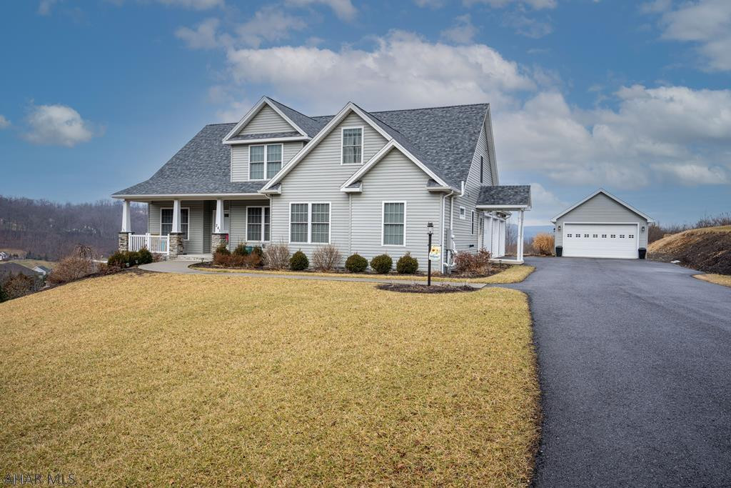 Well constructed 2 story home in Pleasant View Estates. 1st floor Owners' Suite and Laundry make for easy living. The Great Room has vaulted ceilings, a stone FP and doors leading to the patio.  The kitchen is a Foodie's delight! Granite C-tops, Wolf Range with extra large exhaust. Upstairs you'll find 3 additional BRs and a full bath, plus a loft area.  Hosting Family events is a breeze with the entertainment area in the lower level complete with a kitchenette, FR, Bath and pool table space!  There is radiant flooring around the kitchen area for chilly days.  Enjoy Spring evenings on the patio...beautiful views. Attached is a 3 car garage with work sink & entrance to the bment...also included is a detached 2 car garage for the toys or workshop!  Hardscaping and Fire Pit done by Tussey Mt.