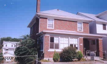 CHARMING 2 STORY BRICK ON A FULLY FENCED DOUBLE LOT. 3 BEDROOM, 1 BATH, 3/4 BATH IN BASEMENT. 1 CAR DETACHED GARAGE. COZY CHERRY KITCHEN.