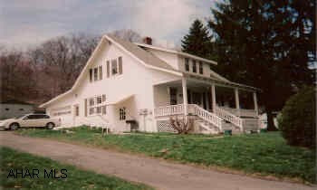 1.5 Story ;frame house, full basement, attached 1-car garage. 3BR, 1 full, 1 half and 1 3/4 baths. Situated on 1.43 partially wooded acres. Beautiful hardwood floors and trim throughout, 26x30 block garage with electric.