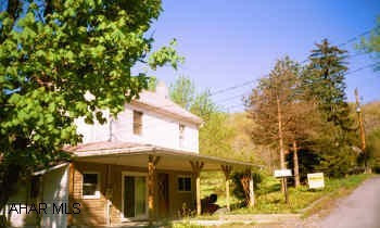 Newer siding, furnace, and roof. Logan Twp find. 2 story on 1/2 acre lot in Beverly Hills area. Another 1/2 acre lot beside this is for sale also see #10488.