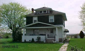 2 story, 3 bedroom, 1.5 bath, dining room, living room.  Kitchen, unfinished basement.  3 out building on property, 3 bedrooms, 1.5 bath, kitchen, dining, living room. Needs updating.