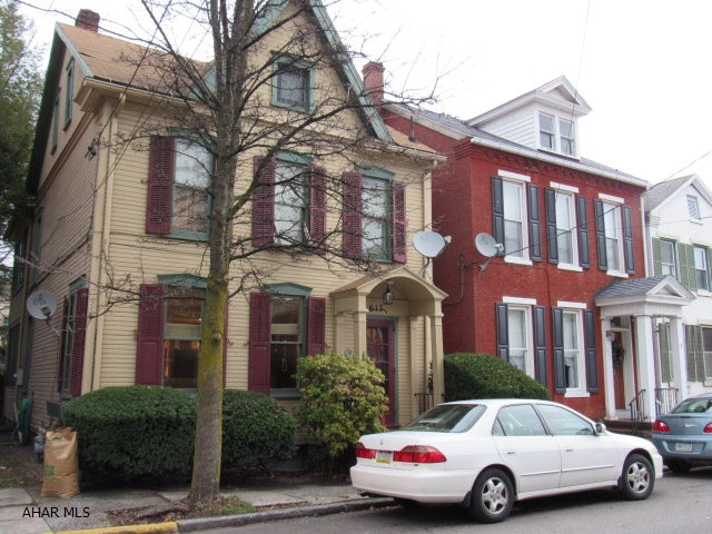 This 2 story home is in the downtown area of Huntingdon along Church St. & is within close proximity to the Juniata College, Schools, Hospital and shopping areas.The home offers a spacious Kitchen with Brookhaven cabinets, recessed & under counter lighting.The eat-in kitchen area has built-in cabinets & has French doors leading to the 12 x 20 treated wood deck & private fenced in yard. The Living room has the Built-in bookcases. The second floor has nice sized bedrooms,a newer remodeled 3/4 bathroom with Maple cabinets, granite counter tops & ceramic tile floor, & the office area is bright and cozy. The walk up attic offers plenty of storage. Call for your showing today!